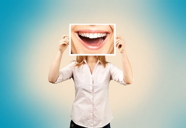 A person holding a poster of mouth