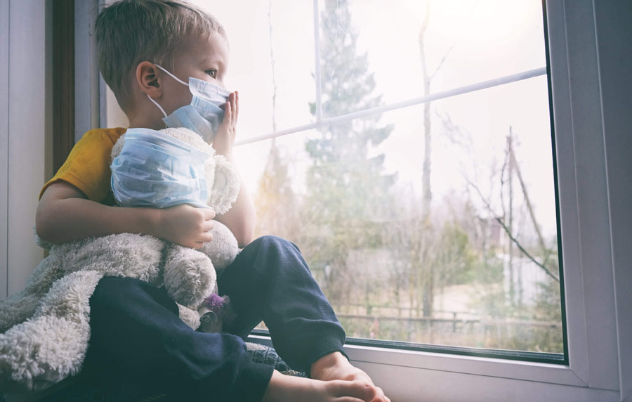 Child sitting in the window