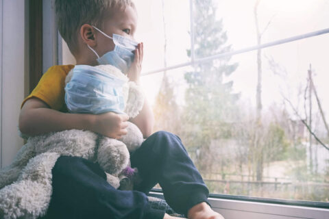 Child sitting in the window