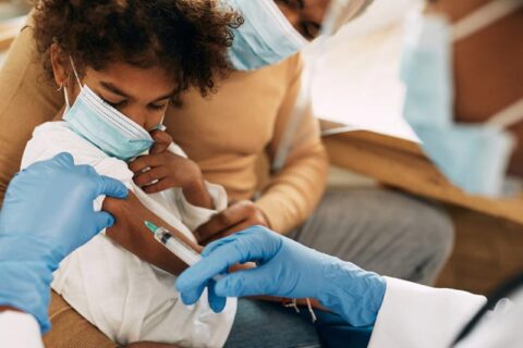 little boy getting vaccine