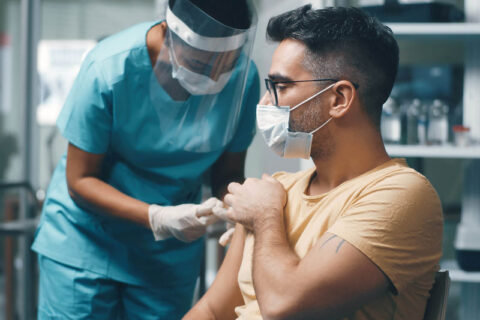 Man taking COVID Vaccine