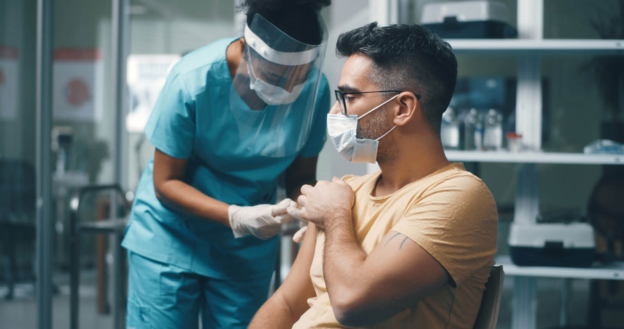 Man taking COVID Vaccine