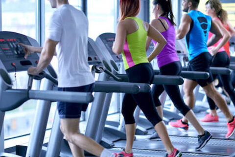 people running on treadmill in gym