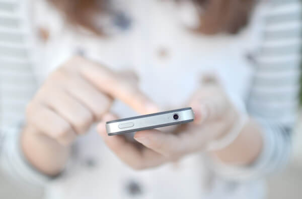 a smartphone in a woman's hand