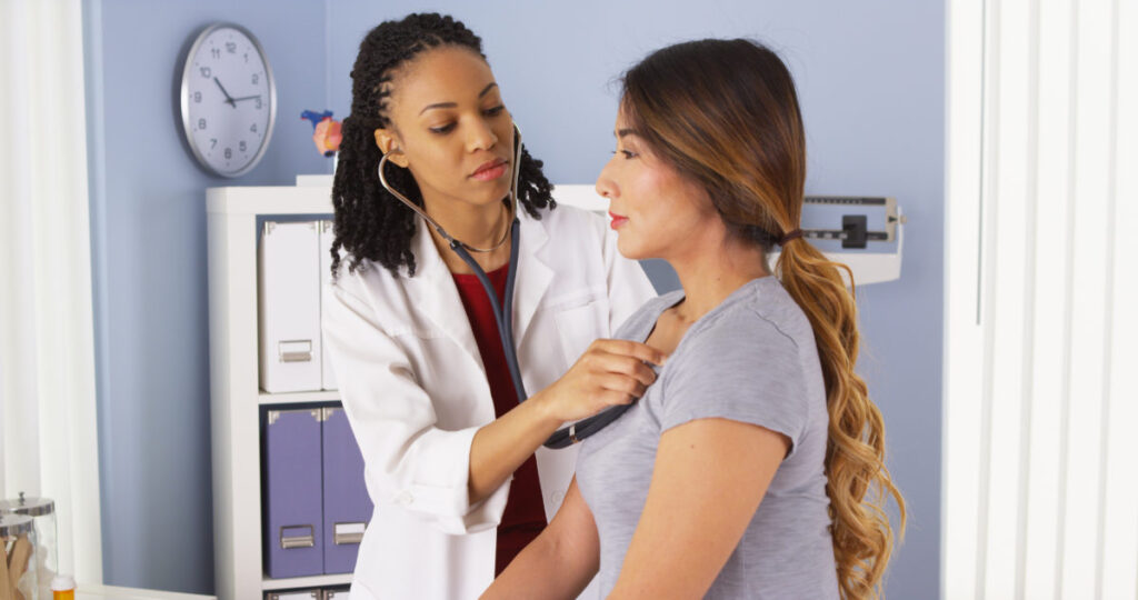 doctor treating her patient