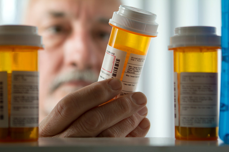 A man holding a medicine