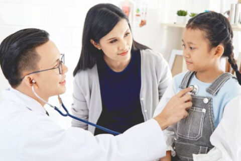 Doctor checking a small girl