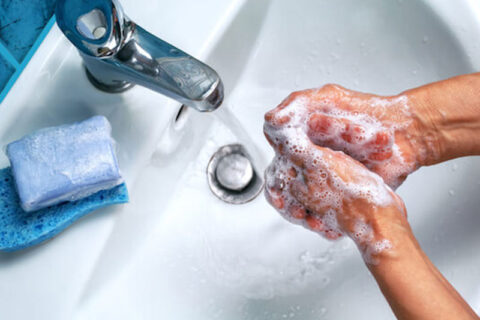 a person washing hands