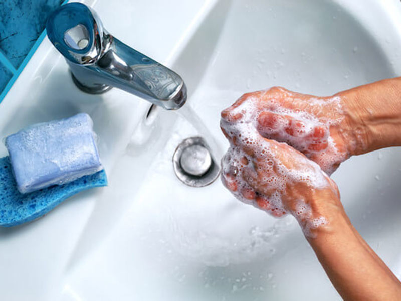 a person washing hands