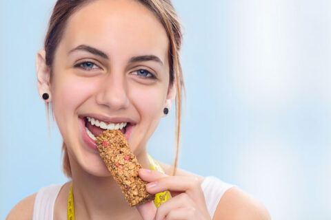 woman eating chocolate bar