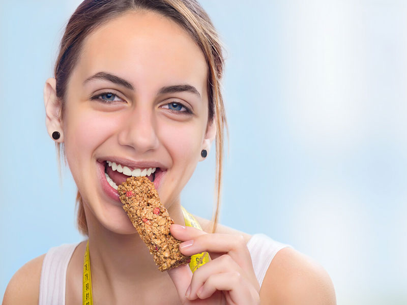 woman eating chocolate bar