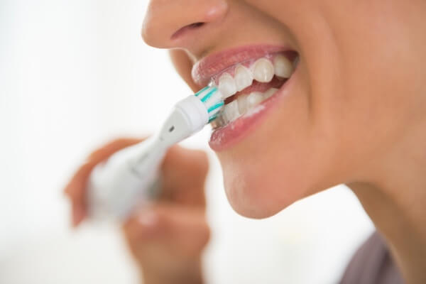 A Women brushing her teeth