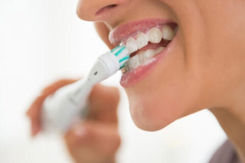 A Women brushing her teeth