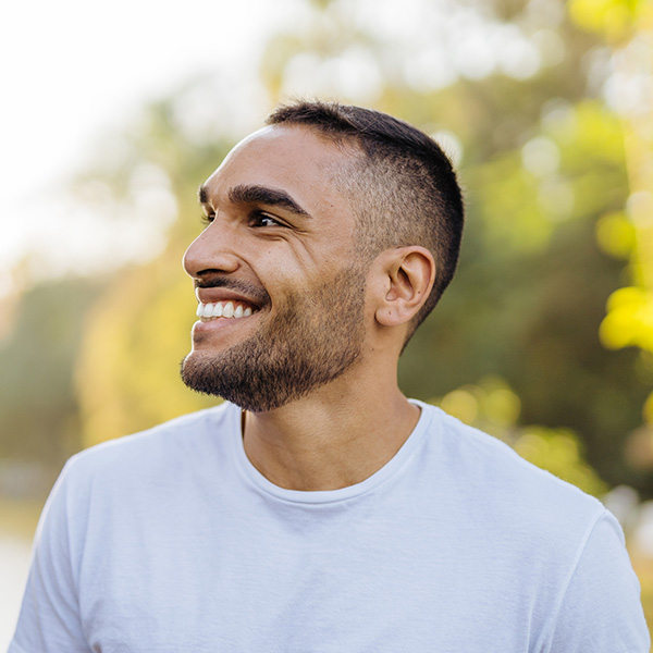 Young smiling athlete in public park