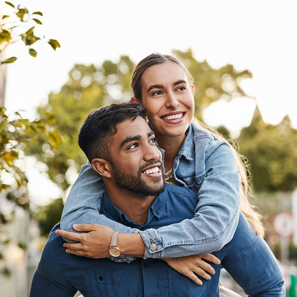 piggyback and happy couple with love in the city