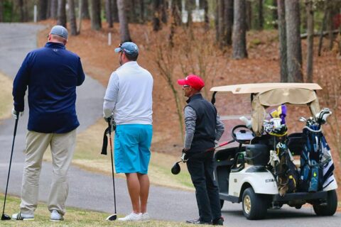 Men playing golf