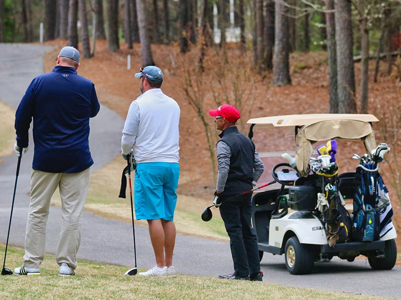 Men playing golf