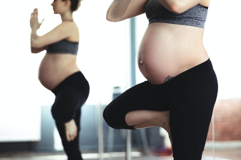 pregnant women doing yoga