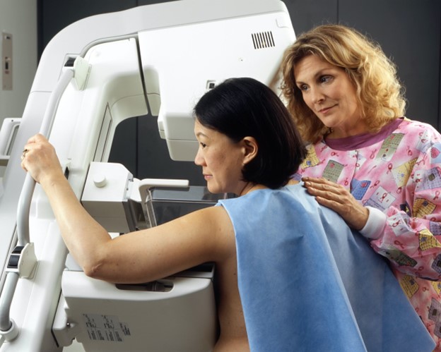  A women checking for breast cancer at Brevard Health Alliance.