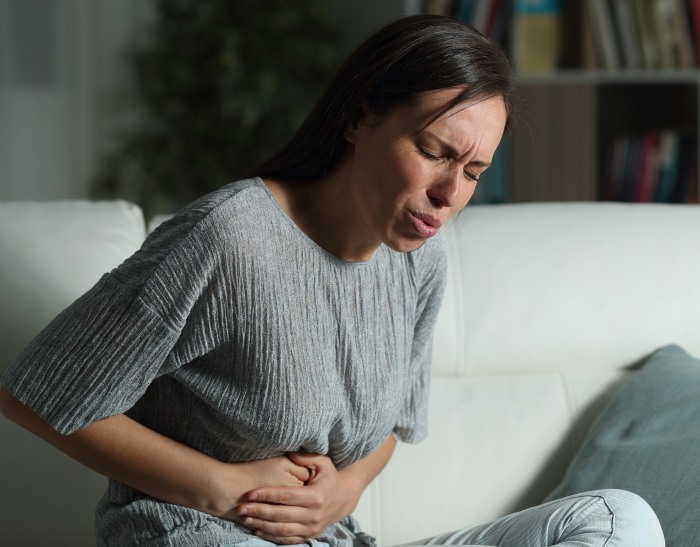 Woman Suffering from Cramps and bleeding during Pregnancy