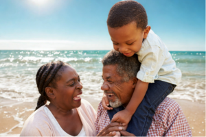 Grandparents and a toddler together on the beach