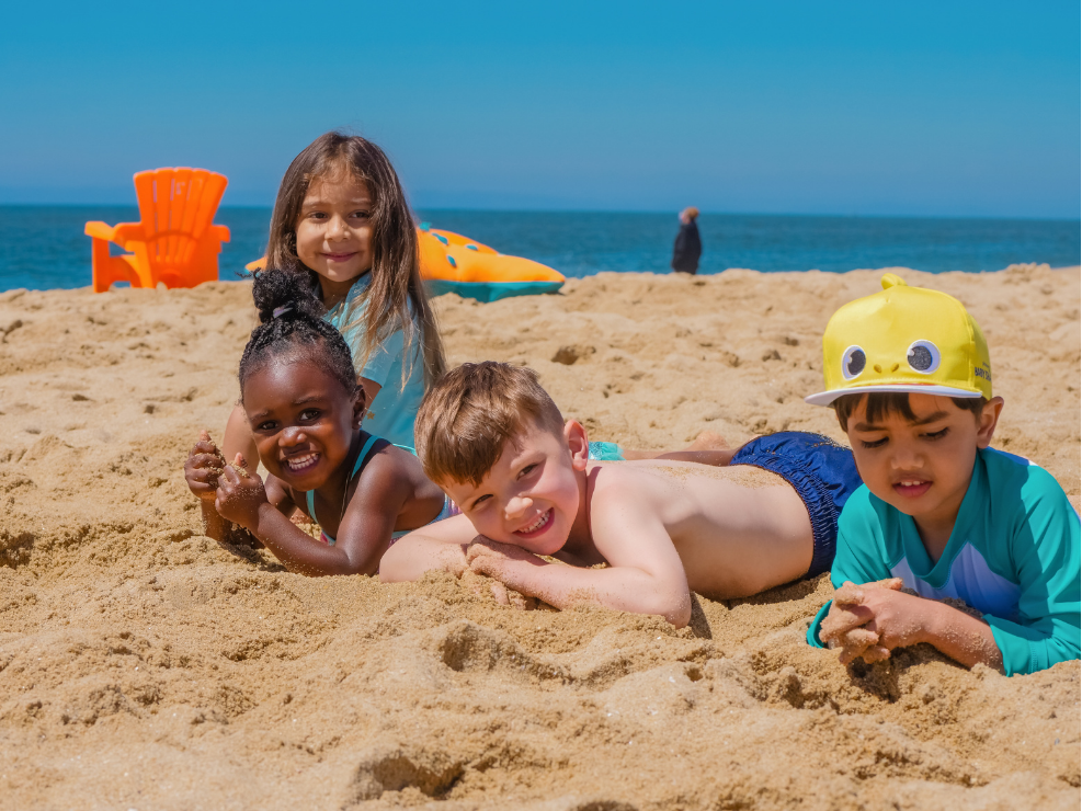 Kids playing in the sand at the beach