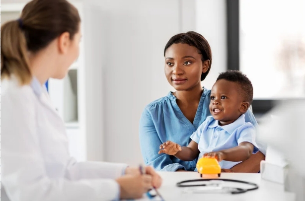 A professional pediatrics consulting the treatment plan with a parent in Cocoa and Malabar, FL