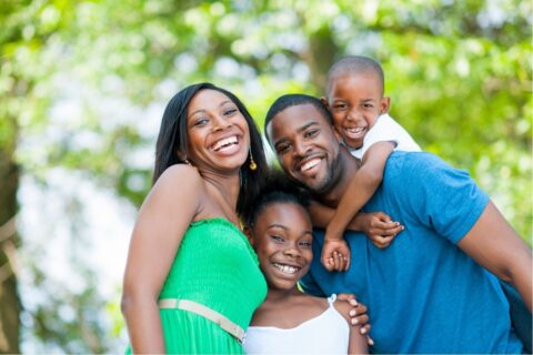 Smiling family of four