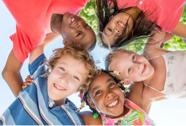 Kids stand in a circle in Brevard County, FL, promoting the importance of healthy snacks for health.