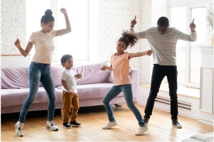 A joyful family dance in a living room in Brevard County, FL, celebrating togetherness and fun
